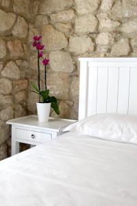 Ένα ή περισσότερα κρεβάτια σε δωμάτιο στο Petrino Eco Village