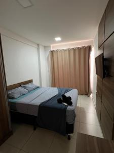 En eller flere senge i et værelse på Flat alto padrão na melhor localização da cidade