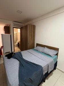 En eller flere senge i et værelse på Flat alto padrão na melhor localização da cidade