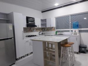 Kuhinja oz. manjša kuhinja v nastanitvi Posada Cocos Place
