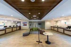 a lobby with a waiting area and a waiting room at Holiday Inn Club Vacations Galveston Seaside Resort in Galveston +126 photos