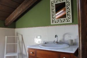 a bathroom with a sink and a mirror at Las cabachuelas casas rurales in San Miguel de Valero +74 photos