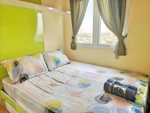 Postel nebo postele na pokoji v ubytování Cheapest 2BR Paragon Apt Karawachi with Pool + 21 fotografií