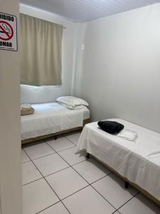 Postel nebo postele na pokoji v ubytování Hotel Andorinha