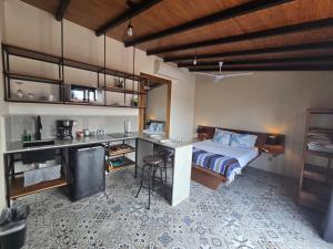a bedroom with a bed and a desk in it at Hotel Boutique Casa Jade in Campeche