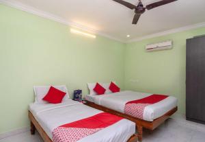 Postel nebo postele na pokoji v ubytování Hotel O Seabreeze Residency
