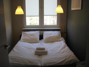 Cama ou camas em um quarto em Apartamenty w centrum Gdyni I