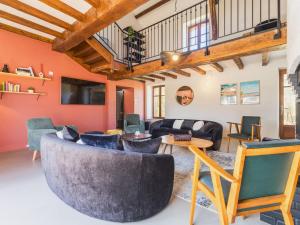 a living room with a couch and chairs at Grande maison de campagne rénovée avec parking et espace détente - FR-1-306-1303 in Malville