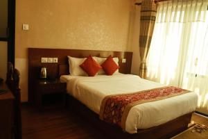 Voodi või voodid majutusasutuse Bojinee Resort toas