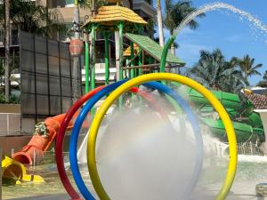 un parque acuático con un colorido tobogán acuático en Ocean view & direct beach access!, en Puerto Vallarta