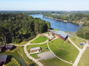 an aerial view of a building next to a river at The Brookside Escape in Antoing