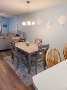 a dining table and chairs in a living room at Seas the day llc in Myrtle Beach