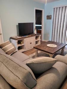 a living room with a couch and a table at Seas the day llc in Myrtle Beach