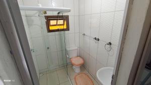 a bathroom with a shower and a toilet and a sink at Recanto Machado in Paraty +28 photos