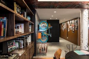 a room with a bike hanging on the wall at Le G&eacute;n&eacute;ral H&ocirc;tel in Paris