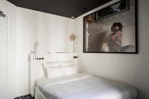 Postel nebo postele na pokoji v ubytování Le Général Hôtel