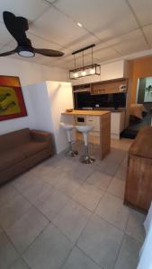 a kitchen with a couch and a table in a room at El rinconcito de Lamadrid in Concordia