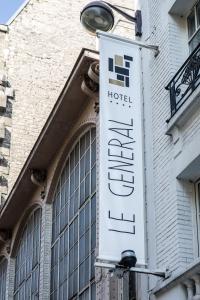 a hotel sign on the side of a building at Le Général Hôtel in Paris