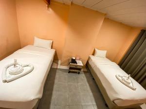 Ένα ή περισσότερα κρεβάτια σε δωμάτιο στο Kaizen Suites