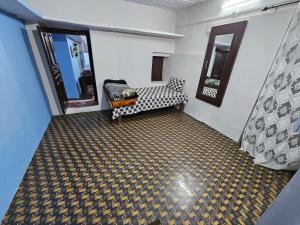 a living room with a couch and a carpet at The Heavens in Almora