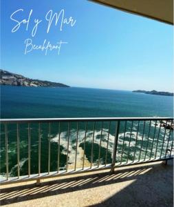 a view of the ocean from a balcony at Torres Gemelas Acapulco Suites in Acapulco +2 photos
