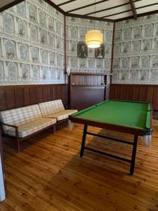 a room with a pool table and a couch at McIntyre homestead in Penshurst