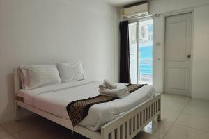 Postel nebo postele na pokoji v ubytování Zenith Life Hotel