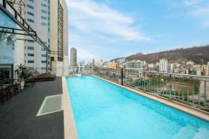 a swimming pool on the balcony of a building at A25 Premium Hotel - Bãi Cháy Hạ Long in Ha Long