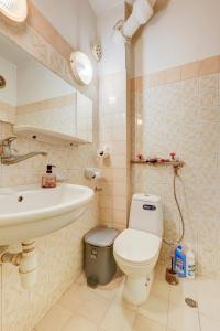 a bathroom with a toilet and a sink at Steady - Guests Rooms in Varna City