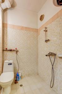 a bathroom with a toilet and a shower at Steady - Guests Rooms in Varna City +34 photos
