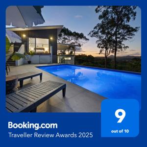 a large swimming pool in a house with avisor at Hinterland Dreamers Poolside Retreat in Yandina Creek