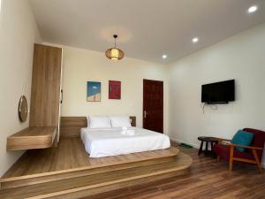 Postel nebo postele na pokoji v ubytování Wonder House Dalat