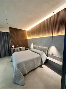 a bedroom with a large bed in a room at Zen escape Sicilia in San Gregorio di Catania +40 photos