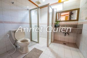 a bathroom with a toilet and a shower and a sink at Camp John Hay 4BR Cabin in Baguio +31 photos