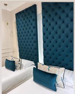 A bed or beds in a room at Nouvelle Maison Rome Luxury Palace
