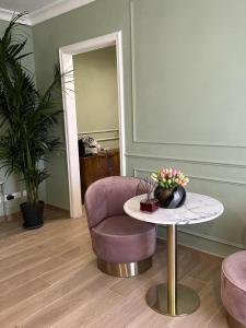 A seating area at Nouvelle Maison Rome Luxury Palace