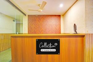 a reception desk with a sign on it in a room at Collection O Nagpur Railway Station Formerly Jagannath Deluxe in Nagpur