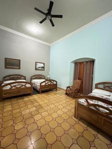 Ένα ή περισσότερα κρεβάτια σε δωμάτιο στο Hostal Vega