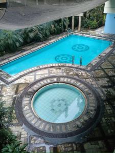 an overhead view of a swimming pool at R&R Entire Rental Unit in Manila