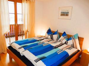 Postel nebo postele na pokoji v ubytování Ferienwohnung Pfrundmatte mit Panoramablick