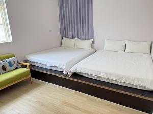 Postel nebo postele na pokoji v ubytování 珊瑚礁民宿