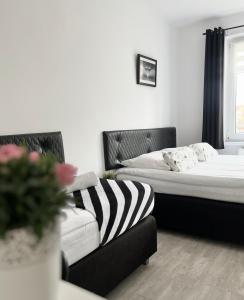 Postel nebo postele na pokoji v ubytování U Borsuków