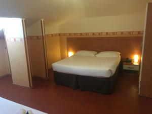 Postel nebo postele na pokoji v ubytování Hotel Liberty