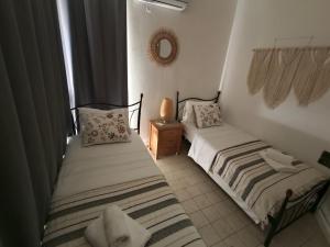 Postel nebo postele na pokoji v ubytování Grapevines Villas Makrygialos