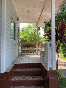 a porch with awning on a house at Seasalt 1 Cozy Studio with Full kitchen and fast WiFi in Thong Sala
