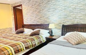 Ένα ή περισσότερα κρεβάτια σε δωμάτιο στο The Windsor Boutique Resort