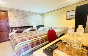Ένα ή περισσότερα κρεβάτια σε δωμάτιο στο The Windsor Boutique Resort +32 φωτογραφίες