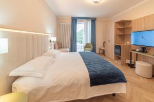 Posteľ alebo postele v izbe v ubytovaní Hotel Due Palme