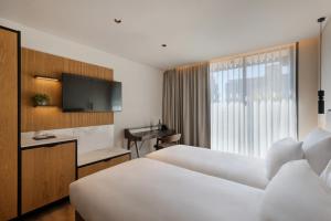 Postel nebo postele na pokoji v ubytování Jerusalem Gardens Hotel
