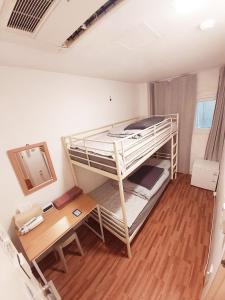 Katil atau katil-katil dalam bilik di Blue Boat Hostel Myeongdong
